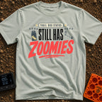Still Has Zoomies - T-Shirt in Bay - A typography-based design reading "TRAIL DOG STATUS: STILL HAS ZOOMIES" with...