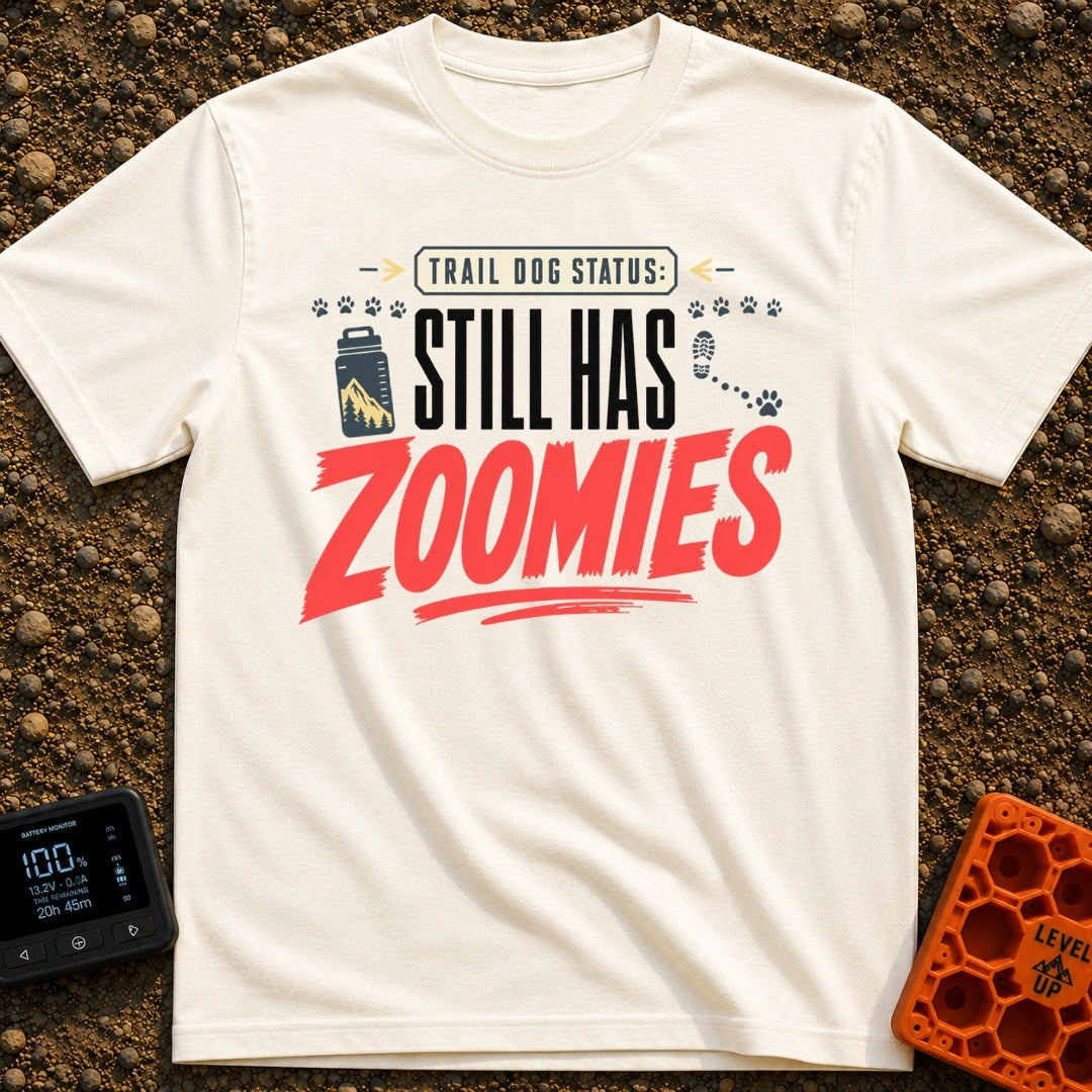 Still Has Zoomies - T-Shirt in Ivory - A typography-based design reading "TRAIL DOG STATUS: STILL HAS ZOOMIES" with...