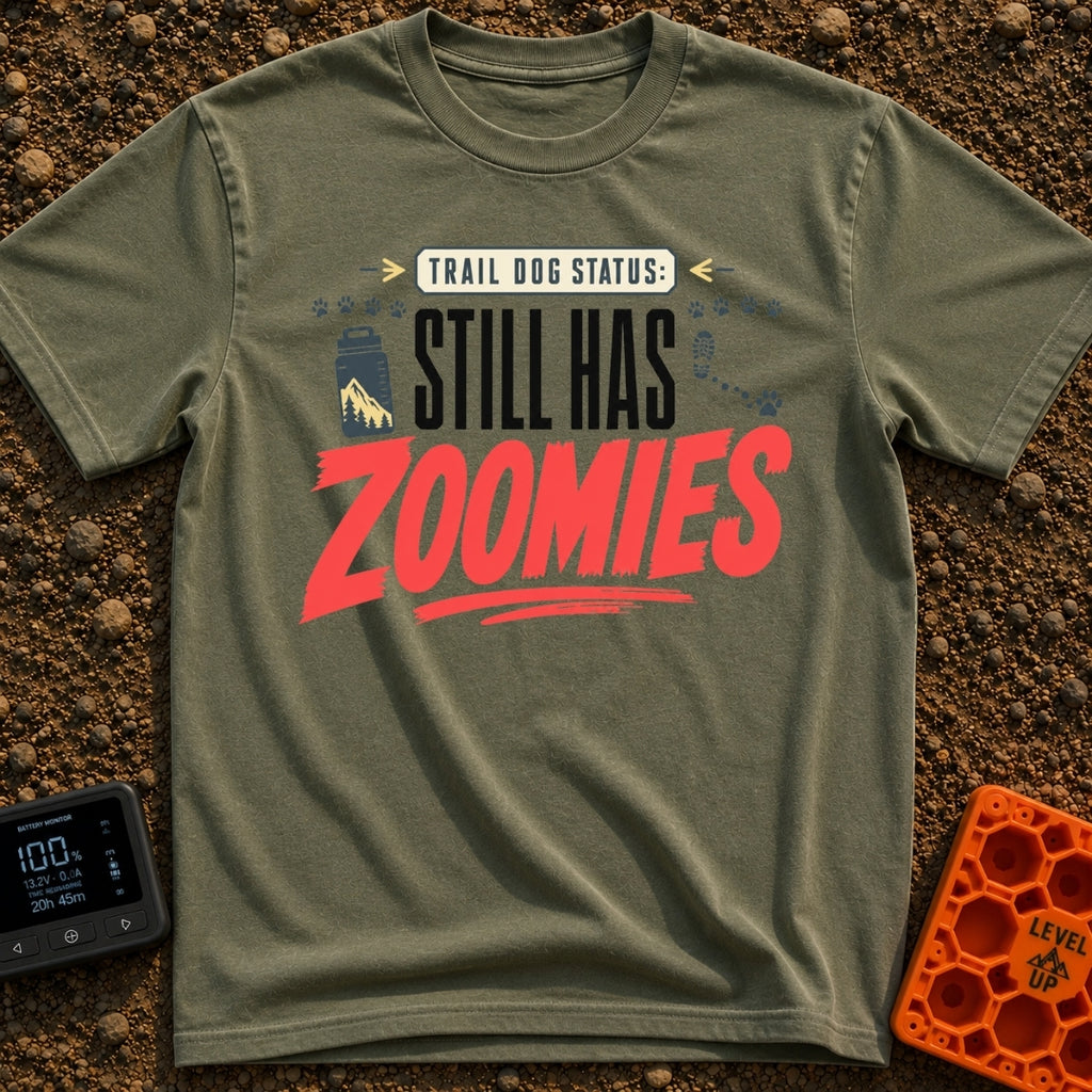 Still Has Zoomies - T-Shirt in Moss - A typography-based design reading "TRAIL DOG STATUS: STILL HAS ZOOMIES" with...