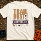 Dust And High Standards - T-Shirt in Ivory - Typographic design reading "TRAIL DUST & HIGH STANDARDS" over a banner,...