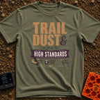 Dust And High Standards - T-Shirt in Moss - Typographic design reading "TRAIL DUST & HIGH STANDARDS" over a banner,...