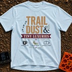 Dust And Tiny Luxuries - T-Shirt in Chambray - The design displays the typographic text "TRAIL DUST & TINY LUXURIES"...