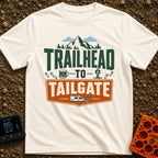 Peaks To Pints - T-Shirt in Ivory - The typographic design reads "TRAILHEAD TO TAILGATE" surrounded by various outdoor...