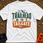 Peaks To Pints - T-Shirt in White - The typographic design reads "TRAILHEAD TO TAILGATE" surrounded by various outdoor...