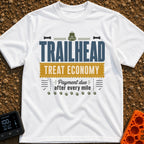 Treats Per Mile - T-Shirt in White - A typographic design featuring the text "TRAILHEAD TREAT ECONOMY" and "Payment due...