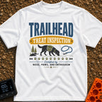 Will Hike For Treats - T-Shirt in White - A graphic design featuring the text "TRAILHEAD TREAT INSPECTION" above a...