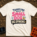 Small Dog Big Opinions - T-Shirt in Ivory - A typographic design featuring the text "TRAVELING WITH A SMALL DOG BIG...