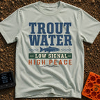 Trout Tranquility Zone - T-Shirt in Bay - A typographic design featuring the text "TROUT WATER" in large blue letters...