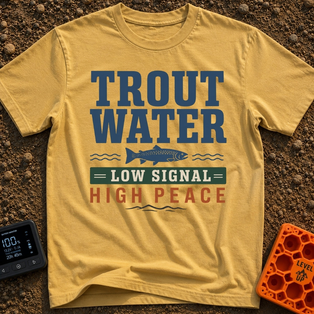 Trout Tranquility Zone - T-Shirt in Mustard - A typographic design featuring the text "TROUT WATER" in large blue letters...