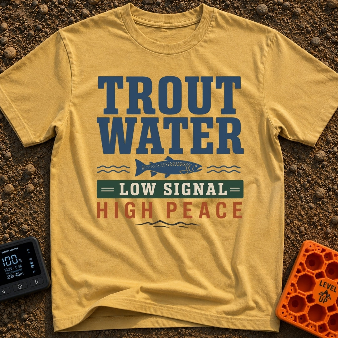 Trout Tranquility Zone - T-Shirt in Mustard - A typographic design featuring the text "TROUT WATER" in large blue letters...