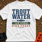 Trout Tranquility Zone - T-Shirt in White - A typographic design featuring the text "TROUT WATER" in large blue letters...