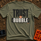 Trust The Bubble - T-Shirt in Moss - A typographic design featuring the words "TRUST THE BUBBLE" alongside illustrations...