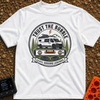 Level Ground Legends - T-Shirt in White - A circular badge illustration showing a white camper van with a roof-mounted...