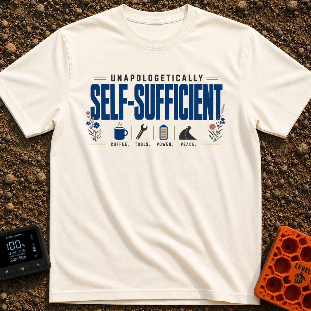 Unplugged And Unbothered - T-Shirt in Ivory - The design features the text "UNAPOLOGETICALLY SELF-SUFFICIENT" prominently...