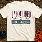 Zero Bars Zero Cares - T-Shirt in Ivory - A typographic design reading "UNBOTHERED & OFF-GRID" alongside the phrases...