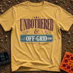 Zero Bars Zero Cares - T-Shirt in Mustard - A typographic design reading "UNBOTHERED & OFF-GRID" alongside the phrases...