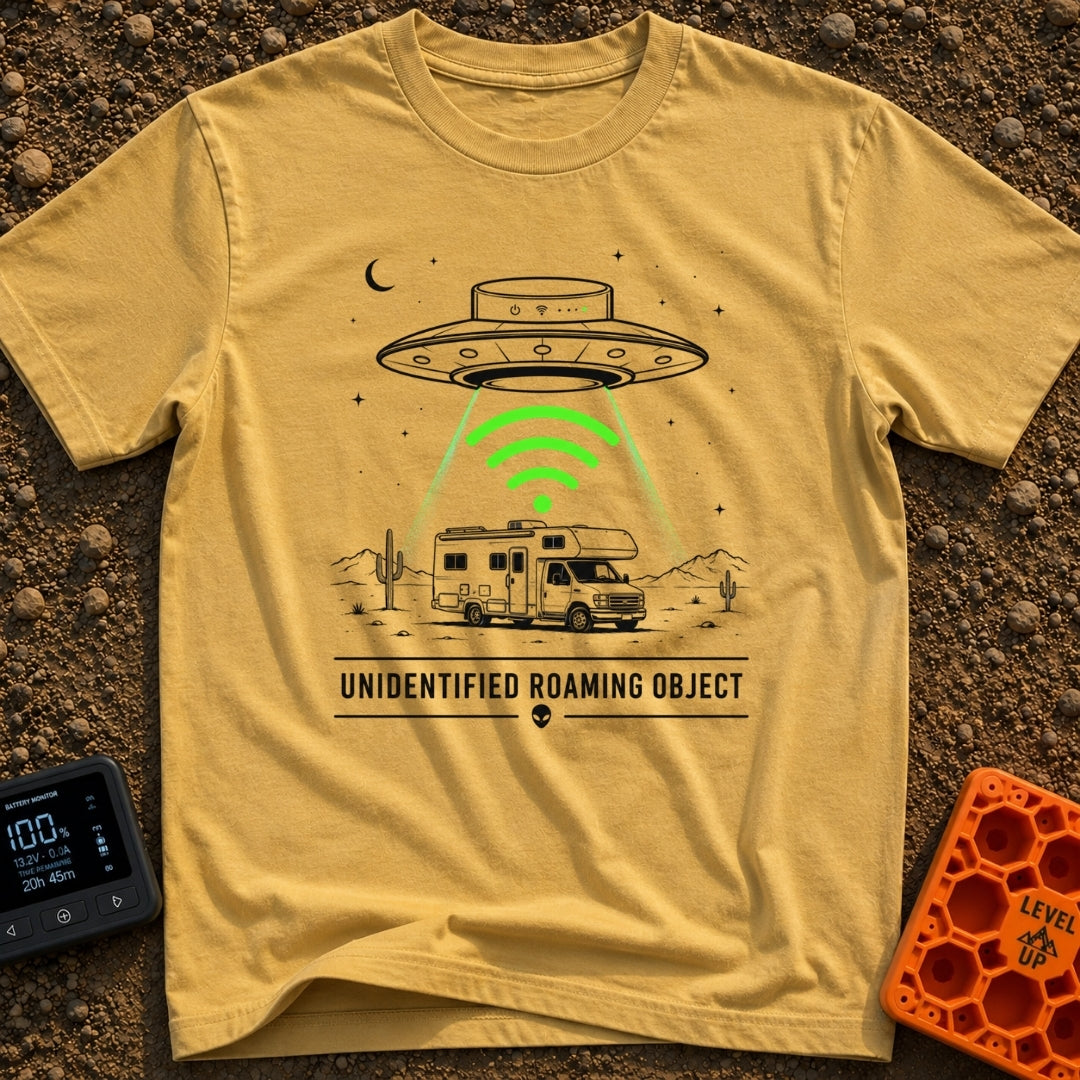 Unidentified Roaming Object - T-Shirt in Mustard - A black-and-white illustration of a Class C RV parked in a desert...