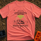 Unidentified Roaming Object - T-Shirt in Watermelon - A black-and-white illustration of a Class C RV parked in a desert...
