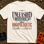 Charged And Unleashed - T-Shirt in Ivory - A typographic design reading "UNLEASHED CHARGED & UNAPOLOGETIC" featuring moon...