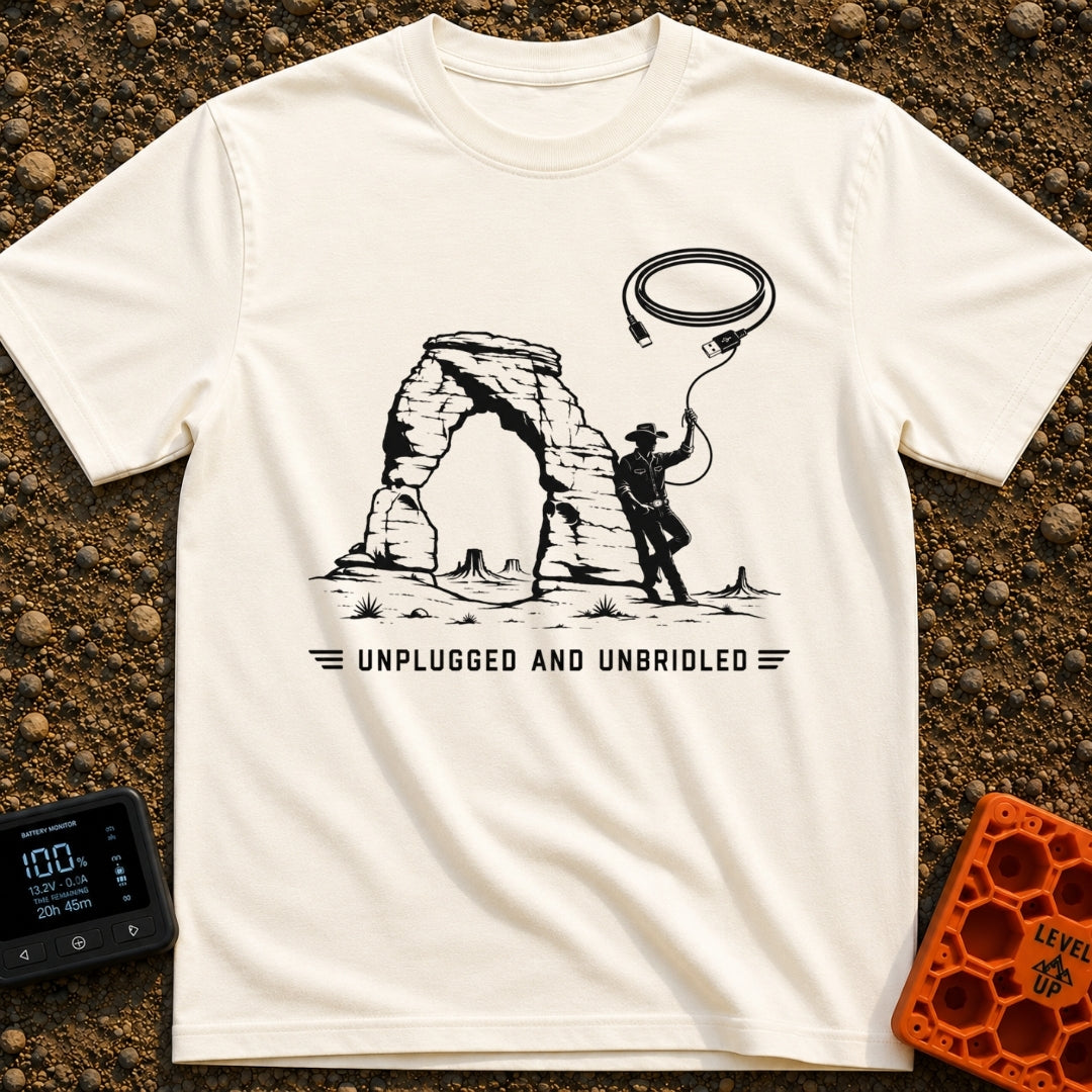 USB Rodeo Wrangler - T-Shirt in Ivory - A black and white illustration of a cowboy leaning against a large natural rock...