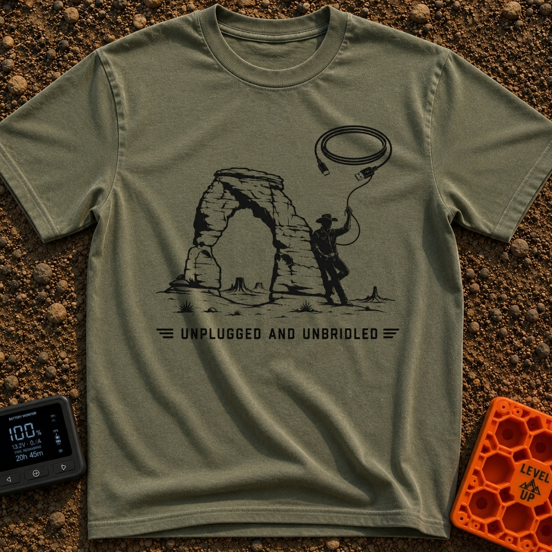 USB Rodeo Wrangler - T-Shirt in Moss - A black and white illustration of a cowboy leaning against a large natural rock...