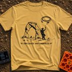 USB Rodeo Wrangler - T-Shirt in Mustard - A black and white illustration of a cowboy leaning against a large natural rock...