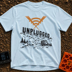 Zero Bars Five Stars - T-Shirt in Chambray - A camper van driving on a winding dirt road in a mountainous landscape, with...