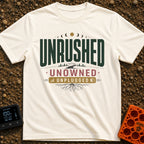 Unplugged And Unbothered - T-Shirt in Ivory - A typographic design featuring the words "UNRUSHED UNOWNED UNPLUGGED"...