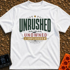 Unplugged And Unbothered - T-Shirt in White - A typographic design featuring the words "UNRUSHED UNOWNED UNPLUGGED"...