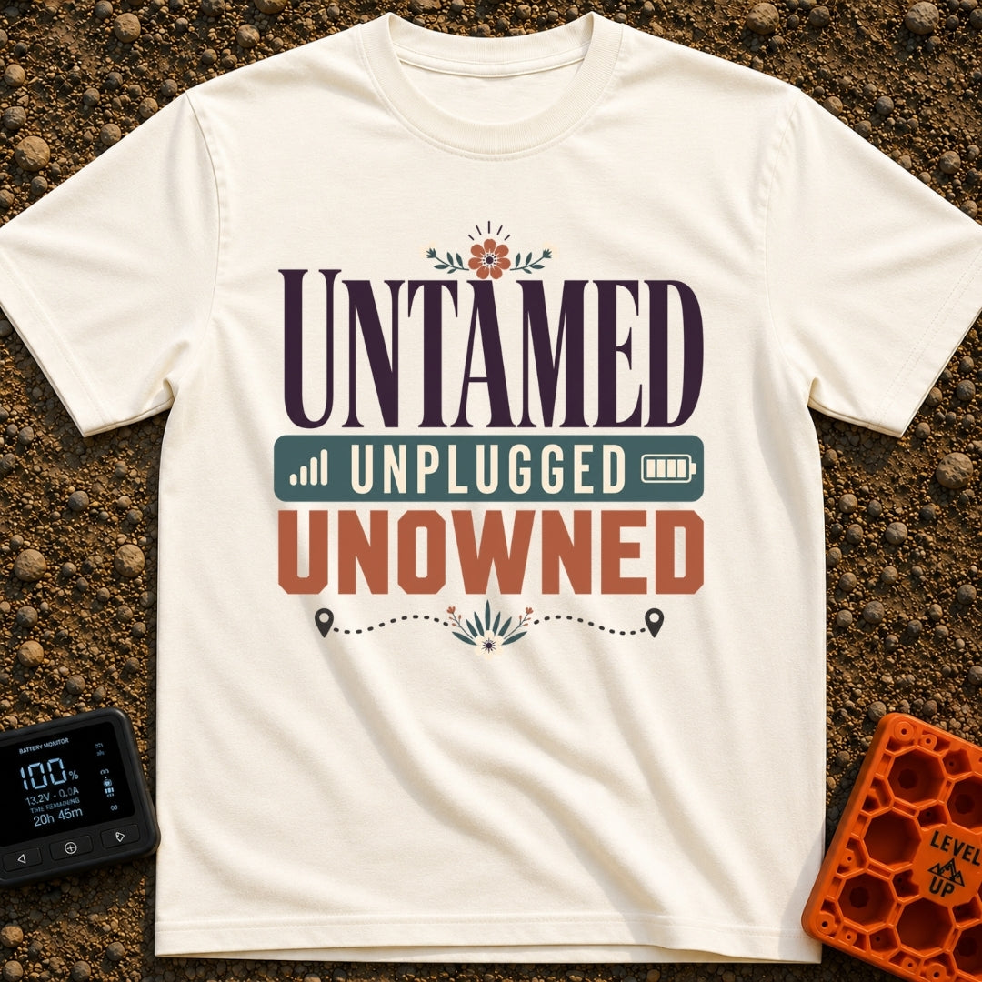 Untamed And Unplugged - T-Shirt in Ivory - A typographic design featuring the words "UNTAMED," "UNPLUGGED," and "UNOWNED"...