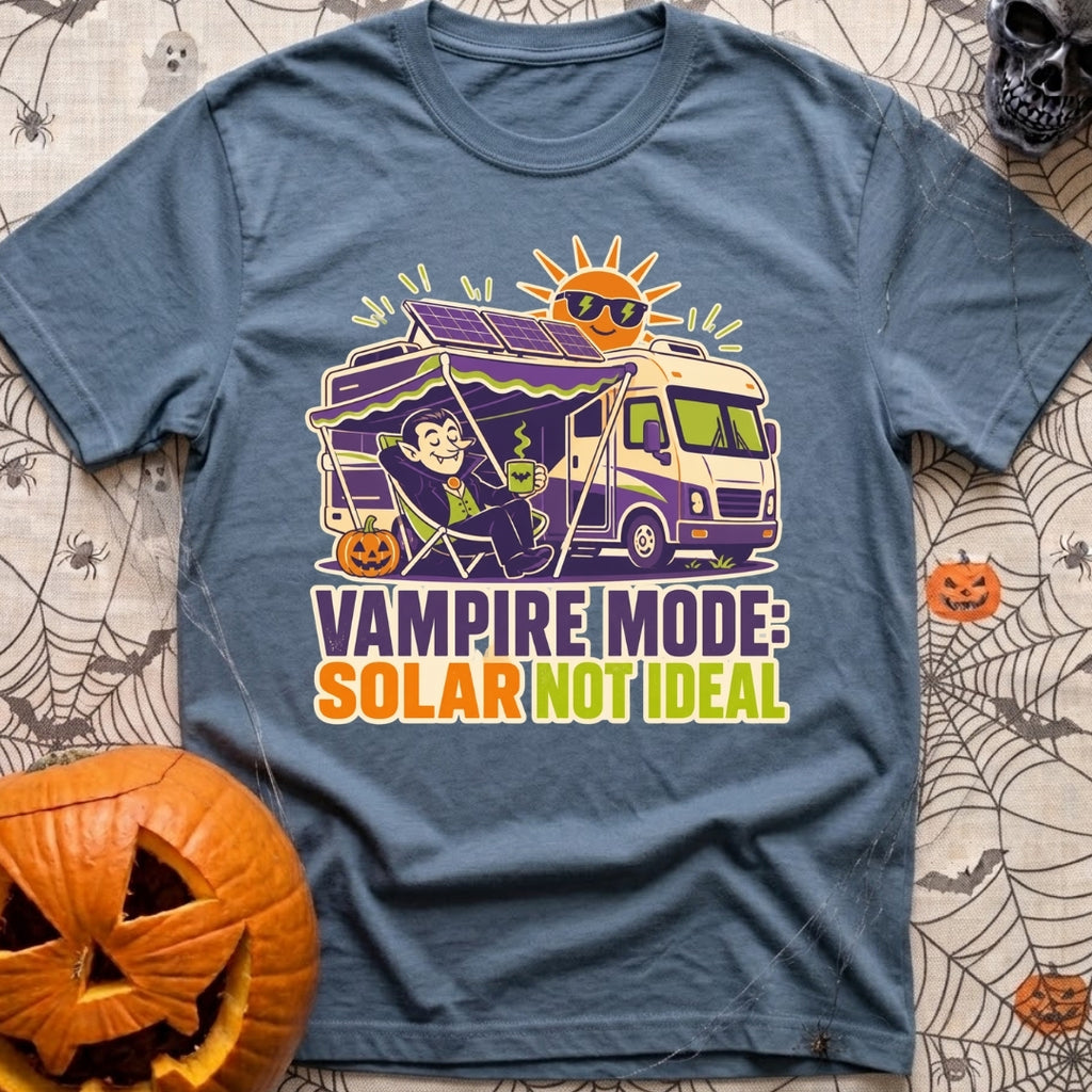 Solar Sucks For Vampires - T-Shirt in Blue Jean - A cartoon illustration of a vampire relaxing in a camp chair holding a...