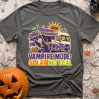 Solar Sucks For Vampires - T-Shirt in Pepper - A cartoon illustration of a vampire relaxing in a camp chair holding a...