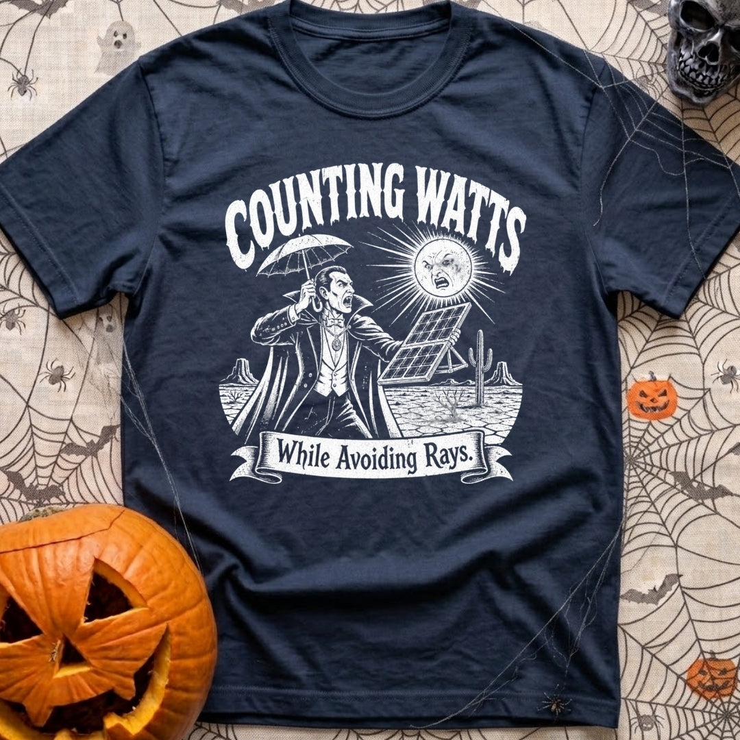 The Vampires Dilemma - T-Shirt in Navy - A line drawing of a vampire standing in a desert landscape, holding a parasol to...