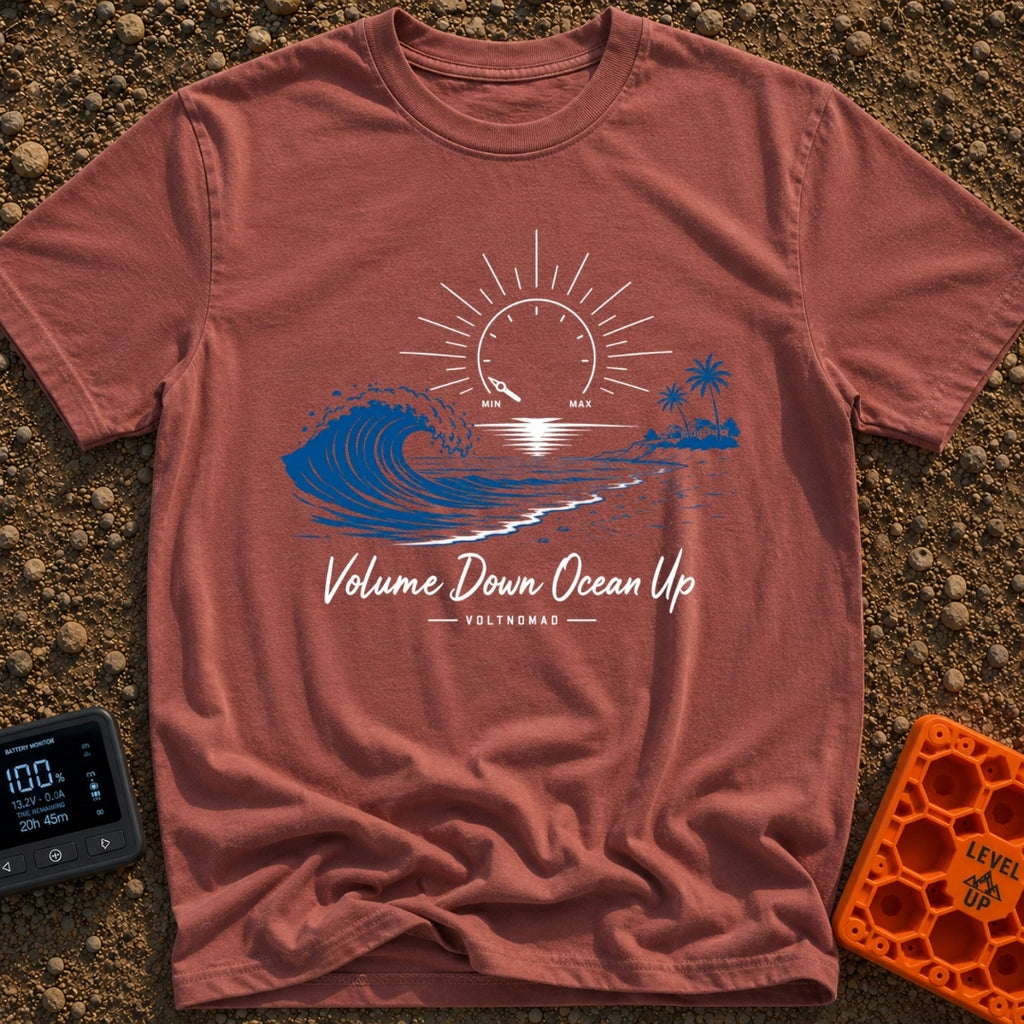 Wave Volume Control - T-Shirt in Brick - A graphic illustration featuring a large blue ocean wave on the left and a sandy...