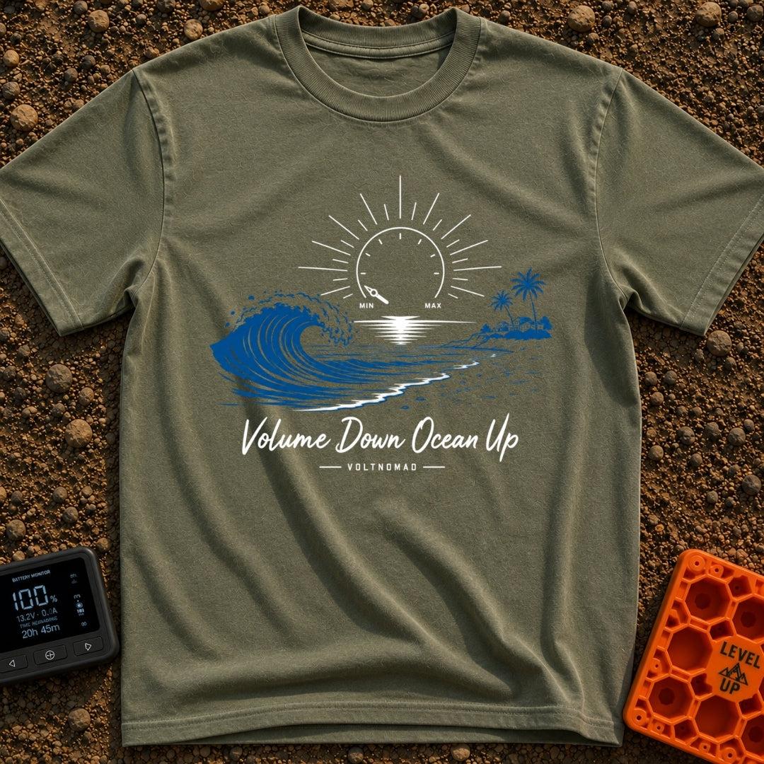 Wave Volume Control - T-Shirt in Moss - A graphic illustration featuring a large blue ocean wave on the left and a sandy...