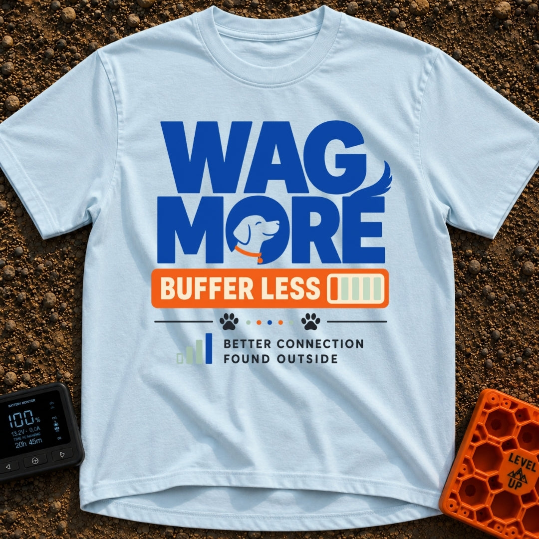 Wag More Buffer Less - T-Shirt in Chambray - A typographic design reading 'WAG MORE' in large blue letters with a dog's...