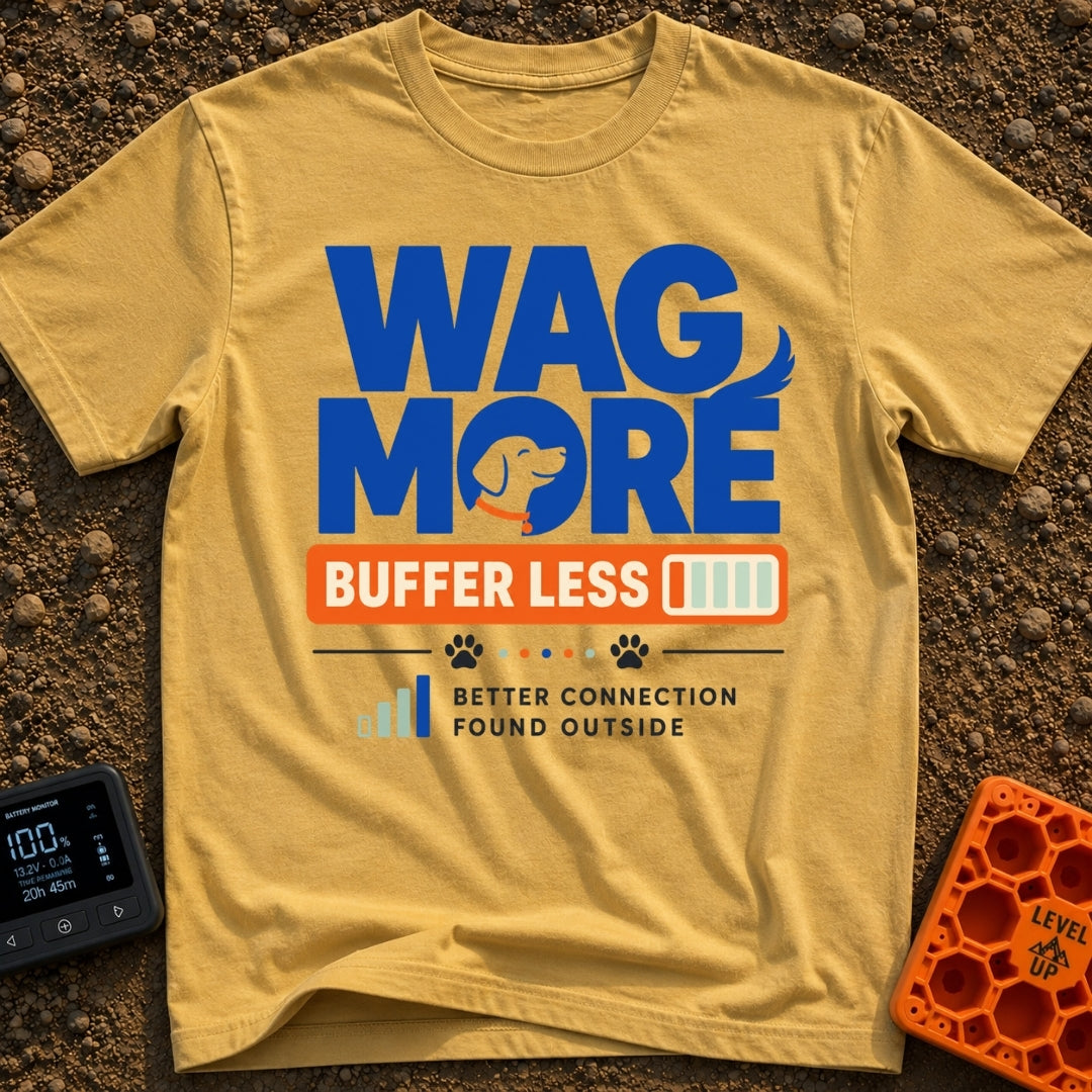 Wag More Buffer Less - T-Shirt in Mustard - A typographic design reading 'WAG MORE' in large blue letters with a dog's...