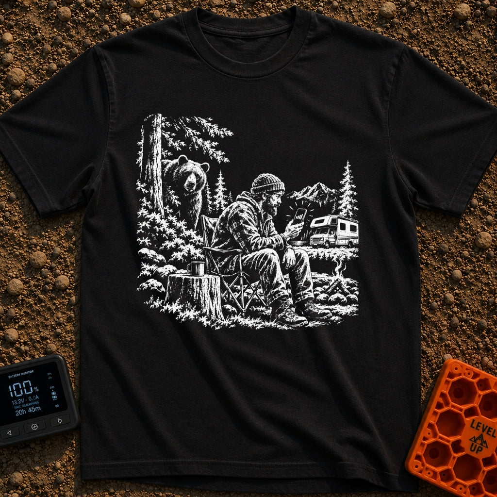 Meet The Locals - T-Shirt in Black - A black and white illustration of a man sitting by a campfire looking at his...