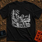 Meet The Locals - T-Shirt in Black - A black and white illustration of a man sitting by a campfire looking at his...