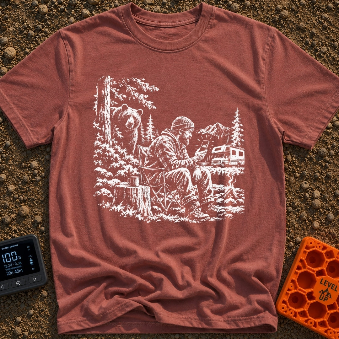 Meet The Locals - T-Shirt in Brick - A black and white illustration of a man sitting by a campfire looking at his...
