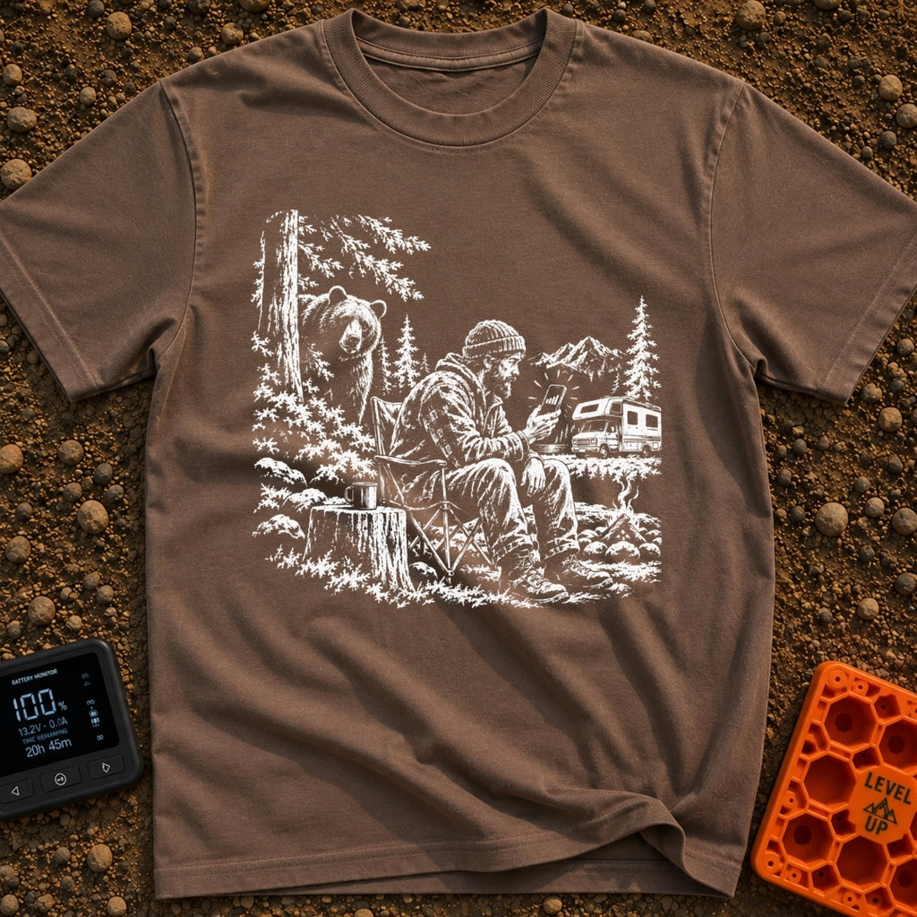 Meet The Locals - T-Shirt in Espresso - A black and white illustration of a man sitting by a campfire looking at his...