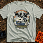 Water Pump Therapy - T-Shirt in Bay - A badge-style illustration showing a mechanical water pump resting on a therapist's...