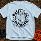 Tank Half Full - T-Shirt in Chambray - A distressed black and white circular badge featuring an analog gauge with the...