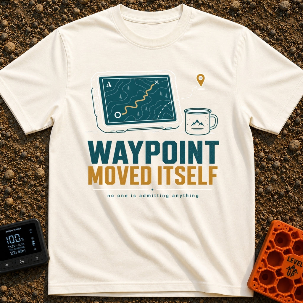 The Waypoint Lied - T-Shirt in Ivory - A graphic showing a digital tablet displaying a topographical map with a winding...