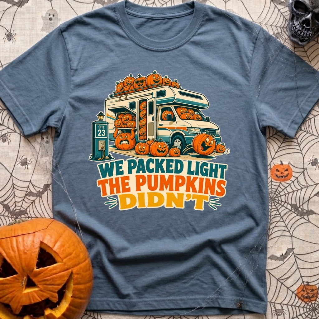 Packed Light Except Pumpkins - T-Shirt in Blue Jean - A cartoon motorhome parked at a campsite hookup labeled "Site 23",...