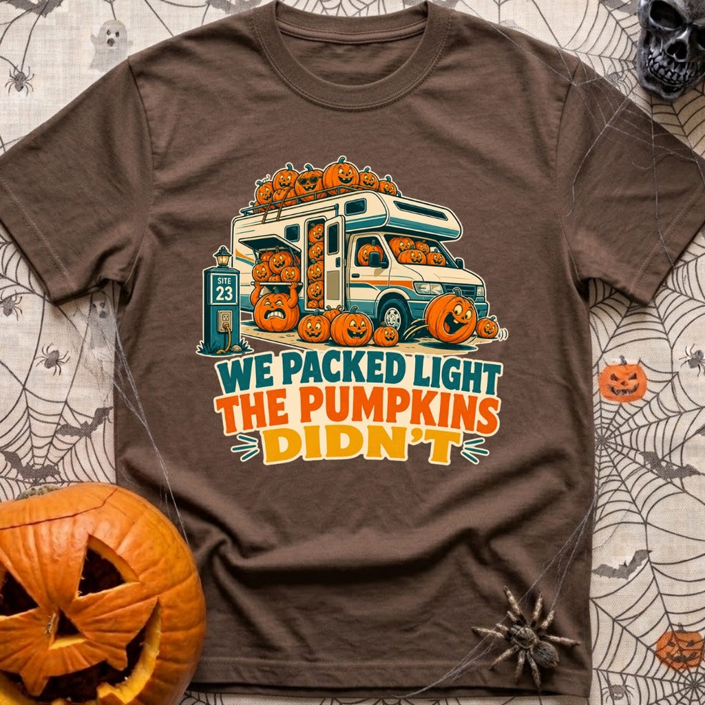 Packed Light Except Pumpkins - T-Shirt in Espresso - A cartoon motorhome parked at a campsite hookup labeled "Site 23",...