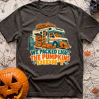 Packed Light Except Pumpkins - T-Shirt in Graphite - A cartoon motorhome parked at a campsite hookup labeled "Site 23",...