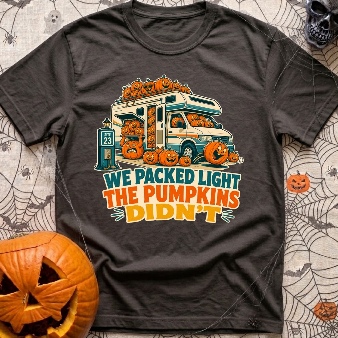 Packed Light Except Pumpkins - T-Shirt in Graphite - A cartoon motorhome parked at a campsite hookup labeled "Site 23",...