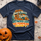 Packed Light Except Pumpkins - T-Shirt in Navy - A cartoon motorhome parked at a campsite hookup labeled "Site 23",...