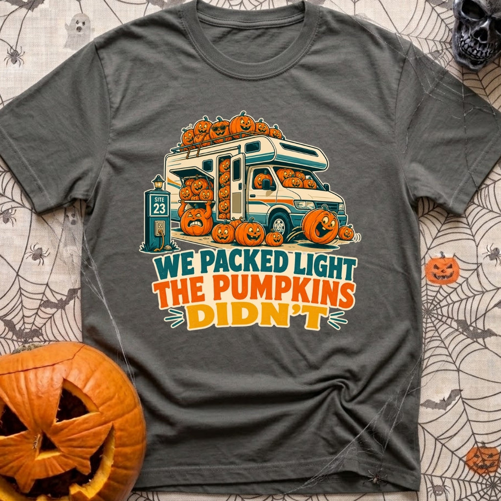 Packed Light Except Pumpkins - T-Shirt in Pepper - A cartoon motorhome parked at a campsite hookup labeled "Site 23",...